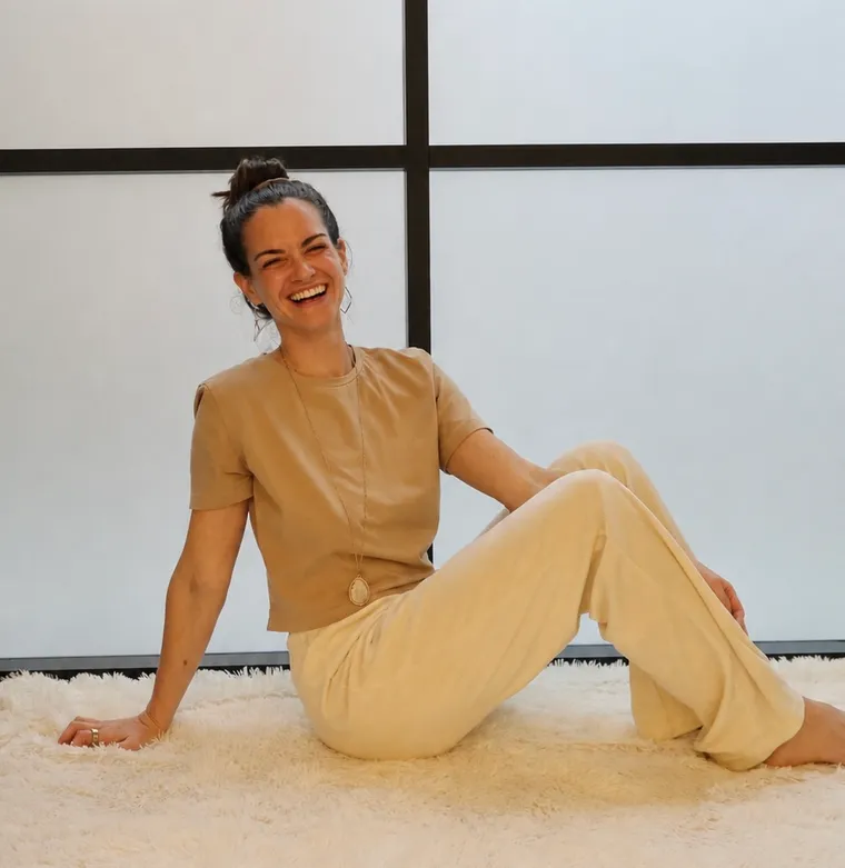 Dr. Anne Marie Hampe, sitting and laughing